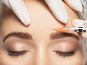 Close up of BOTOX injection on Eyebrows