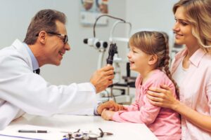 Doctor giving child an eye exam